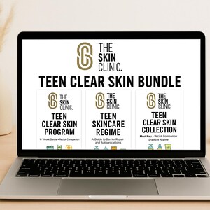 May include: A laptop displays "TEEN CLEAR SKIN BUNDLE" from The Skin Clinic. The screen shows three book covers: "TEEN CLEAR SKIN PROGRAM", "TEEN SKINCARE REGIME", and "TEEN CLEAR SKIN COLLECTION". A white mug, vase with dried plants, and a small bowl are on the desk.
