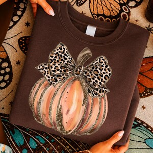 Pumpkin Sweatshirt,Leopard Bow Fall Crewneck,Autumn Pullover,Cute Halloween Gift,Cozy Women’s Seasonal Top,Spooky Harvest Fashion Style