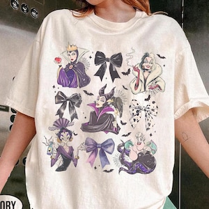 May include: A white ceramic mug with a black handle and the text "But First, Coffee" in a bold, black font. The mug sits on a white surface, showcasing its clean design.