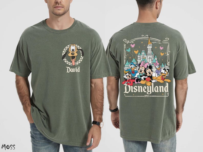 May include: Moss green t-shirt with Pluto's face and the name "David". The back of the shirt has a Disneyland graphic with Mickey, Minnie, Donald, Daisy, and Goofy. The text "Disneyland 1955" is also visible.