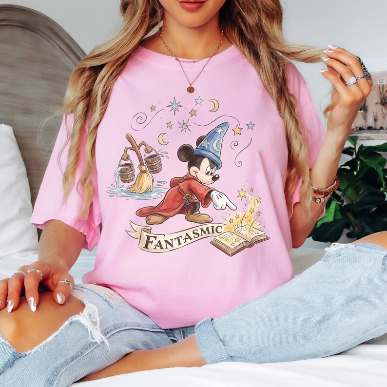 May include: A white ceramic mug with a black handle and the text "But First, Coffee" in a black, bold font. The mug is on a white surface. The mug is approximately 4 inches tall.