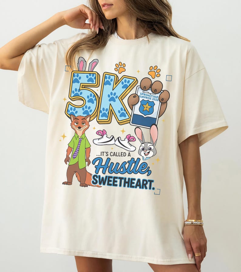 May include: A white ceramic mug with a black handle and the text "But First, Coffee" in a black, bold font. The mug is on a white surface.