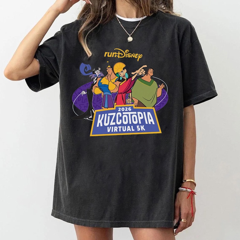 May include: Black t-shirt featuring a colorful graphic from the movie "The Emperor's New Groove." The design includes the text "runDisney" and "Kuzcotopia Virtual 5K 2026."