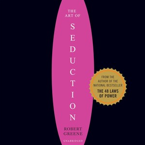 May include: A book cover with a dark background and a large vertical pink oval in the center. The text reads THE ART OF SEDUCTION by ROBERT GREENE UNABRIDGED. A gold starburst seal states FROM THE AUTHOR OF THE NATIONAL BESTSELLER THE 48 LAWS OF POWER.