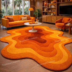 May include: A retro-style rug in shades of orange and yellow, with a unique, flowing shape. The rug's design features concentric layers of colour, creating a warm and inviting feel. It is placed on a wooden floor, adding to the room's aesthetic.