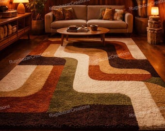 May include: A retro-style area rug with a wavy pattern in shades of brown, orange, green, and cream. The rug is placed on a hardwood floor in a living room setting. The room has a sofa, coffee table, and plants.