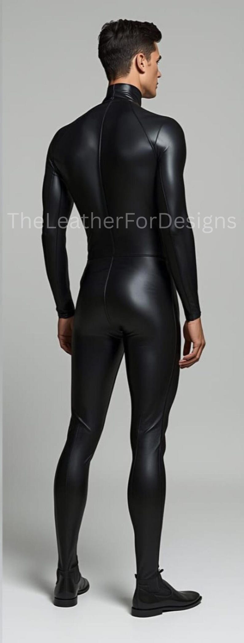May include: A black, form-fitting jumpsuit with long sleeves and a high neckline. The LeatherForDesigns logo is visible. The jumpsuit appears to be made of a shiny, leather-like material. The model is facing away from the camera.