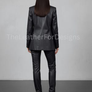 May include: A black leather blazer and matching pants. The blazer has a classic design with a notched lapel and button closure. The pants are fitted. The text "TheLeatherForDesigns" is visible on the image.