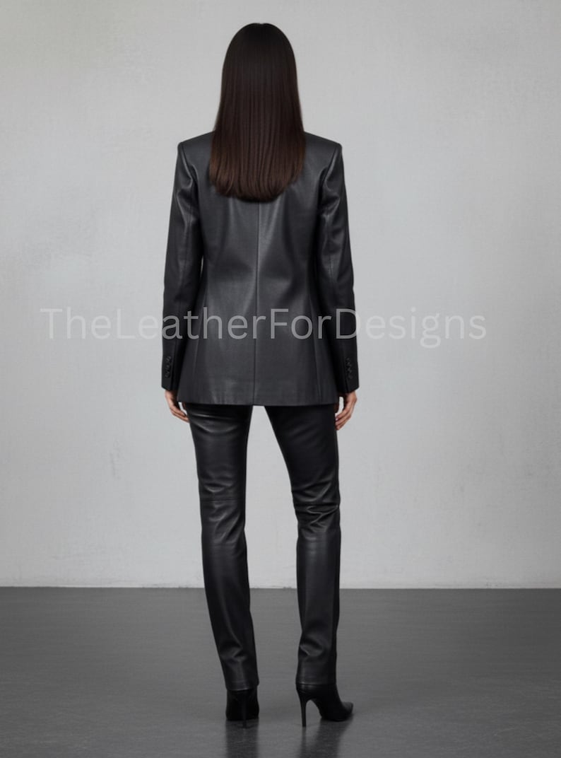 May include: A black leather blazer and matching pants. The blazer has a classic design with a notched lapel and button closure. The pants are fitted. The text "TheLeatherForDesigns" is visible on the image.