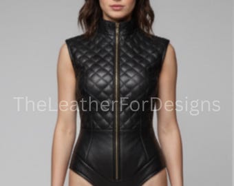 May include: Black leather bodysuit with a quilted bodice and a high collar. The sleeveless design features a full-length zipper and a form-fitting silhouette. The text "TheLeatherForDesigns" is visible.