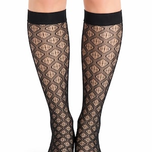 May include: Black knee-high socks with a diamond-patterned lace design. The socks have a solid black band at the top. The socks are made of a sheer material.