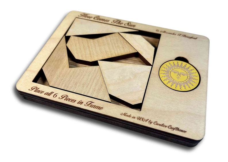 Here Comes the Sun wooden brain teaser puzzle - a fun but challenging puzzle! Can you fit the sun into the large square frame along with all of the other pieces? Great for a desk, coffee table or waiting room. Made in USA by Creative Crafthouse.