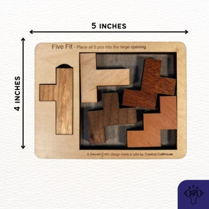 May include: A wooden puzzle with the title "Five Fit - Place all 5 pcs into the large opening". The puzzle is 5 inches wide and 4 inches tall. The puzzle has five wooden pieces that need to be fit into the puzzle board.