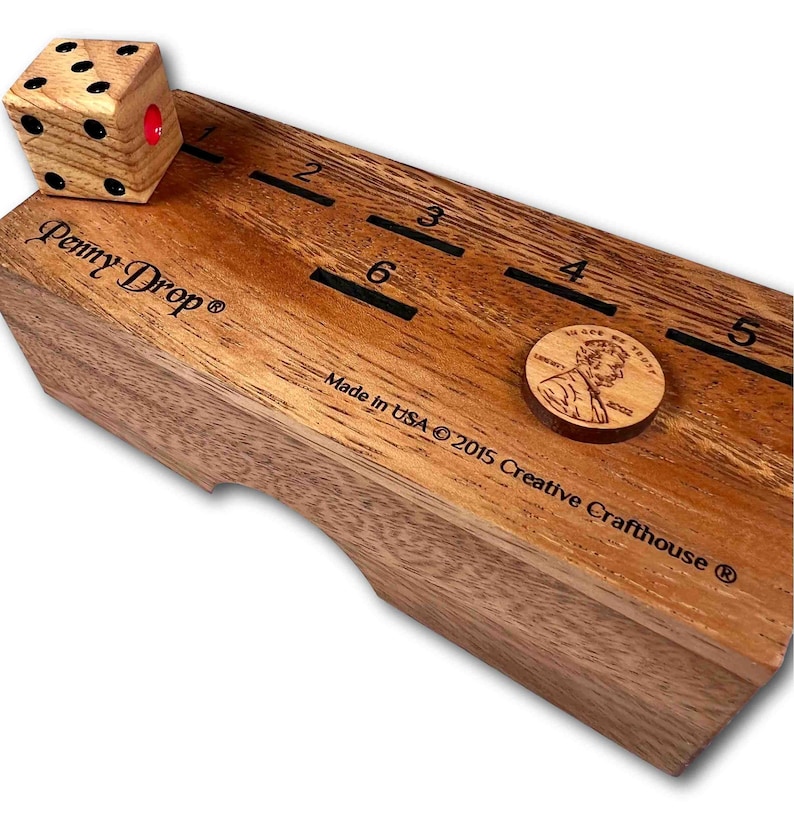 Penny Drop Small Wood Family or Bar Game. Amazing fun for all ages. Wooden dice included. Designed and made and copyrighted by Creative Crafthouse in Hudson, Florida.