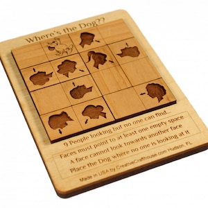 May include: Wooden puzzle game titled "Where's the Dog??" featuring a grid of nine spaces with carved-out face profiles and a dog illustration. The puzzle includes instructions and is made in the USA.