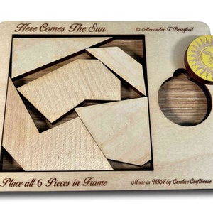 Here Comes the Sun wooden brain teaser puzzle - a fun but challenging puzzle! Can you fit the sun into the large square frame along with all of the other pieces? Great for a desk, coffee table or waiting room. Made in USA by Creative Crafthouse.