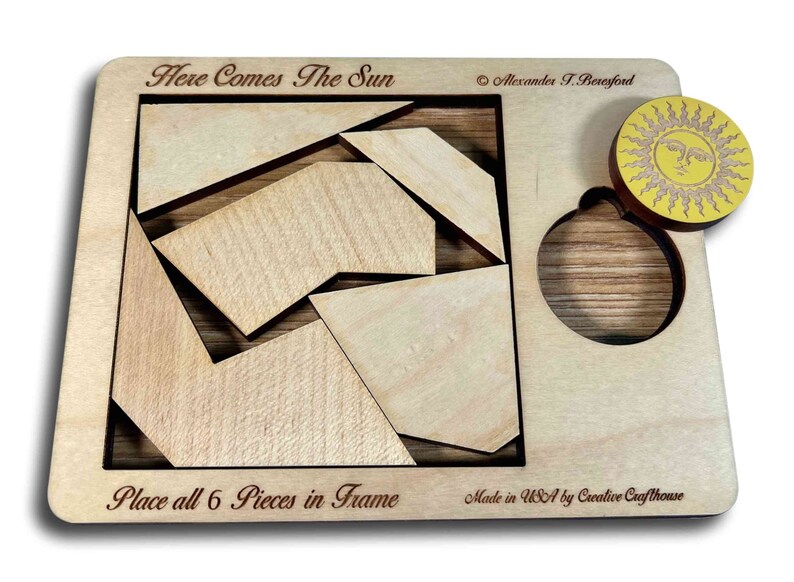 Here Comes the Sun wooden brain teaser puzzle - a fun but challenging puzzle! Can you fit the sun into the large square frame along with all of the other pieces? Great for a desk, coffee table or waiting room. Made in USA by Creative Crafthouse.