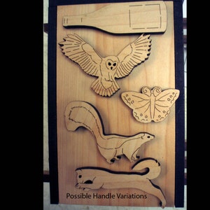 May include: A wooden board with various laser-cut designs, including an owl, a butterfly, a skunk, and a squirrel. The board is labeled "Possible Handle Variations".