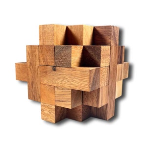 May include: A wooden puzzle with multiple interlocking pieces. The puzzle is made of light and dark brown wood and is in the shape of a cube.