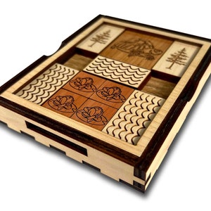 The Great Turtle Escape Wooden Sliding Brain Teaser Puzzle. Slide the pieces so that the turtle can escape through the front slot. A fun and difficult challenge! 9 other starting positions of varying difficulty. Made in the USA by Creative Crafthouse