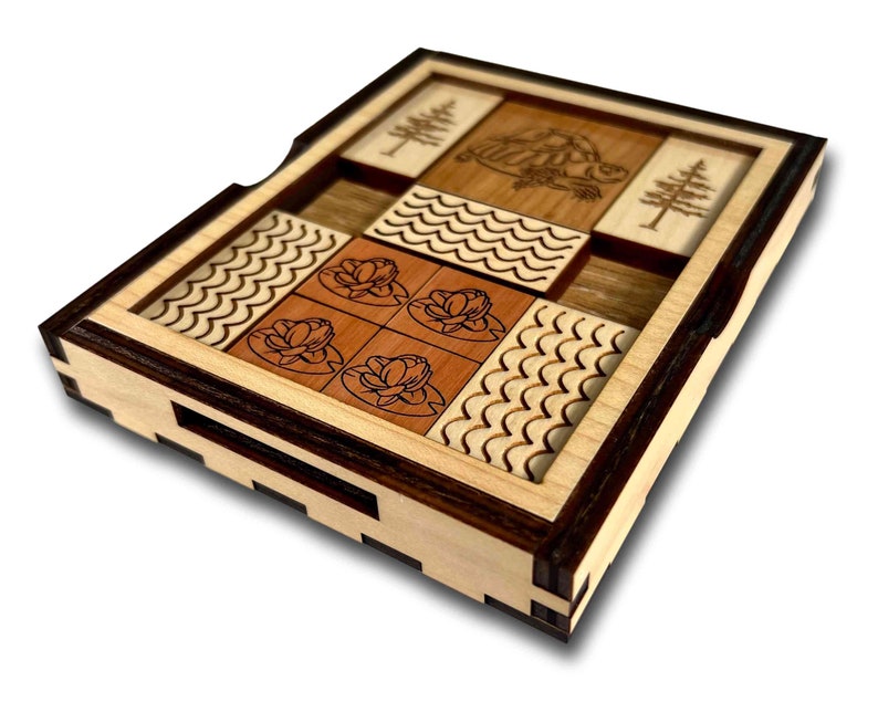 The Great Turtle Escape Wooden Sliding Brain Teaser Puzzle. Slide the pieces so that the turtle can escape through the front slot. A fun and difficult challenge! 9 other starting positions of varying difficulty. Made in the USA by Creative Crafthouse