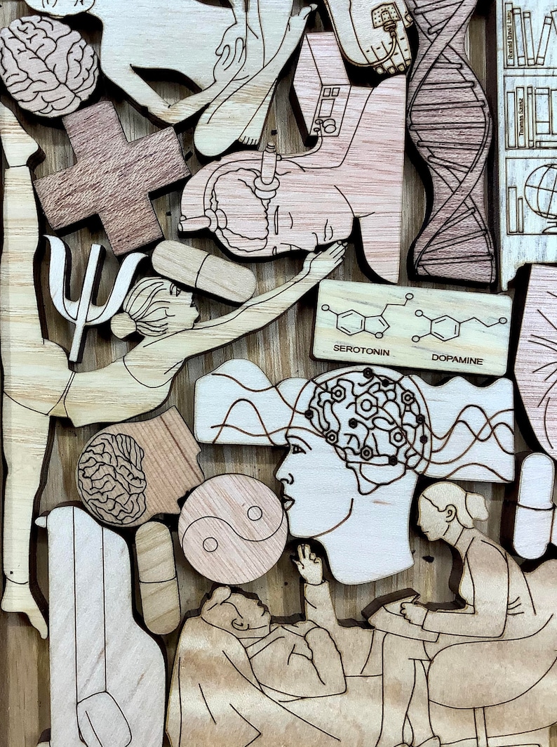 May include: A wooden art piece with a variety of images, including a brain, a yin yang symbol, a person in a yoga pose, and a person in a therapist's chair. The piece also includes the chemical structures for serotonin and dopamine.