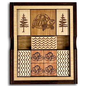 The Great Turtle Escape Wooden Sliding Brain Teaser Puzzle. Slide the pieces so that the turtle can escape through the front slot. A fun and difficult challenge! 9 other starting positions of varying difficulty. Made in the USA by Creative Crafthouse