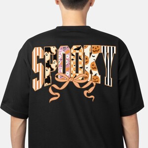 Cute Spooky Halloween Shirt with Ghosts, Pumpkins & Bats – Fun Graphic Tee with Bow Detail for Fall, Trick-or-Treat, or Costume Party