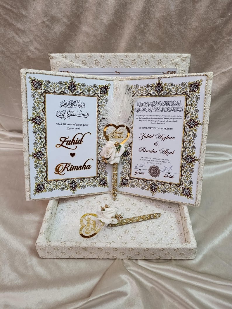 May include: A wedding certificate set with two decorated books, gold and cream in colour. The set includes a pen and a heart-shaped decoration. The text includes the names Fahid and Rimsha.