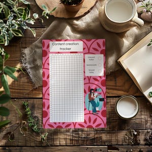 May include: A pink content creation tracker with a grid for tracking posts. The tracker has a floral pattern and the text "Content creation tracker". There are also options for tracking the number of posts.