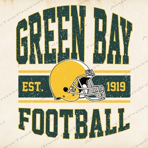May include: A graphic design featuring the text GREEN BAY in dark green, a yellow football helmet with a white face mask, and the text EST. 1919, followed by the word FOOTBALL in dark green, all set against a light cream background.
