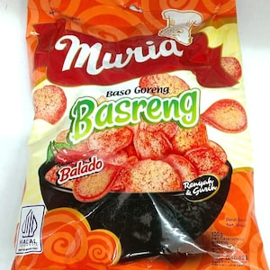 May include: A bag of Muria Basreng Balado, a savory Indonesian snack. The packaging is orange and yellow with the brand name "Muria" in white and the product name "Basreng" in green. The bag features an illustration of the snack.