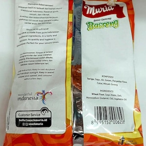 May include: A packaged snack product with the brand name "Muria Basreng" in green and white text. The packaging is primarily orange and white, with Indonesian text and ingredient information. The product is described as a traditional Indonesian snack.