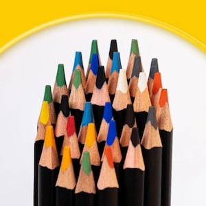 May include: A cluster of sharpened colored pencils with black wooden barrels arranged vertically. The pencil tips display a variety of vibrant hues including red, blue, green, yellow, orange, white, black, and gray, creating a dense, colorful arrangement.