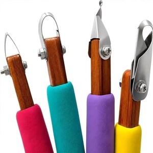 May include: A set of four crafting tools with wooden handles and colorful foam grips in pink, teal, purple, and yellow. Each tool features a distinct metal blade or loop attachment secured with a small silver screw and nut mechanism.