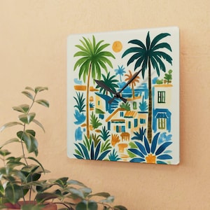 May include: Square wall clock featuring a tropical scene with palm trees, buildings, and a sun. The artwork uses shades of green, blue, orange, and yellow. The clock has black hands and a white background.