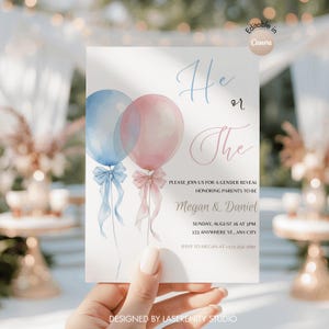May include: A gender reveal invitation featuring watercolor balloons in blue and pink, with the text "He or The". The invitation includes event details and is designed by Laserenity Studio.