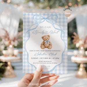 May include: A baby shower invitation card featuring a light blue gingham background, a watercolor teddy bear with a blue bow, and a blue ribbon illustration. The text reads: We Can Bearly Wait, Sebastian Clark, Sunday, October 28, at 12pm.