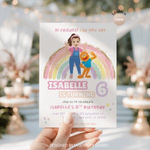 May include: A birthday invitation featuring a cartoon girl and a Muppet character standing in front of a rainbow. The invitation reads "Isabelle is turning 6" and includes event details. The design is in pastel colors with gold glitter accents.
