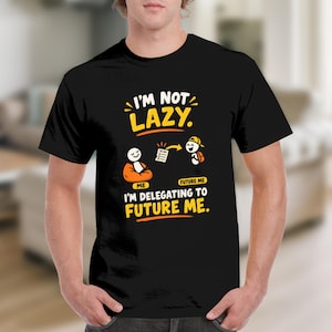 May include: A black t-shirt featuring a graphic with the text I'M NOT LAZY. I'M DELEGATING TO FUTURE ME. The design includes two stick figures, one sitting in an orange chair and another standing with a backpack, connected by a to-do list arrow.