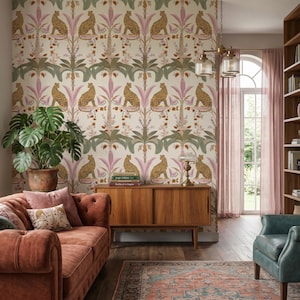 May include: Wallpaper featuring a repeating pattern of leopards sitting under palm trees in shades of pink, green, and brown on a cream background. The design includes stylized floral elements and foliage arranged in a symmetrical vertical layout.