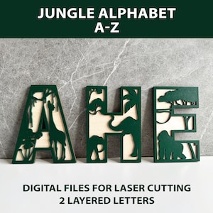 May include: Green wooden letters spelling "AHE" with jungle animal silhouettes. The letters are layered with a light wood backing. The text "JUNGLE ALPHABET A-Z" and "DIGITAL FILES FOR LASER CUTTING 2 LAYERED LETTERS" are displayed.