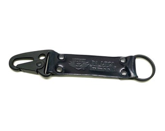 May include: Black leather key chain with a metal clip and a ring. The leather has the text "DA LUCA Handmade in USA" embossed on it.