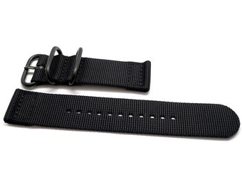 May include: Black nylon watch strap with a black metal buckle. The strap has a textured surface and is designed for a watch with a 20mm lug width.