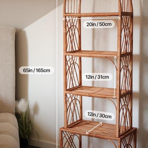 May include: A tall, arched, brown wicker shelf unit with four shelves. The unit is 65 inches tall and the shelves are 20 inches, 12 inches, and 12 inches wide. The shelves have a woven design.