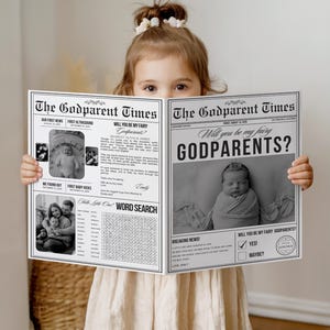 May include: A child holds a newspaper-style announcement titled "The Godparent Times." The black and white design features the headline "Will you be my fairy Godparents?" with a photo of a baby. The newspaper includes a word search and other baby-related content.