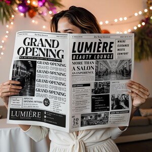 May include: A person holding a newspaper with the headline "GRAND OPENING" and "LUMIÈRE BEAUTY LOUNGE". The newspaper is black and white, advertising a salon. The background includes decorative lights and a table. The text reads "More than a salon, an experience."