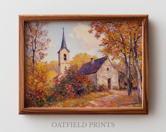 Può includere: Dipinto paesaggistico incorniciato raffigurante una chiesa e una casa circondate da alberi con fogliame autunnale. L'opera presenta un campanile, un edificio in pietra e un sentiero. La cornice è in legno. Il testo "OATFIELD PRINTS" è in basso.