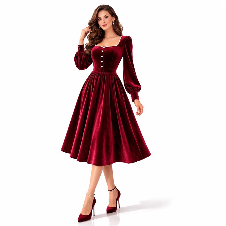 Elegant red velvet midi dress with pearl trim, square neckline, long sleeves, and a modest feminine silhouette.
