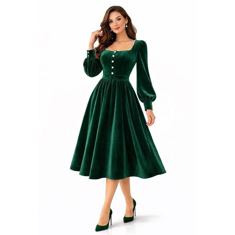 Elegant green velvet midi dress with pearl trim, square neckline, long sleeves, and a modest feminine silhouette.